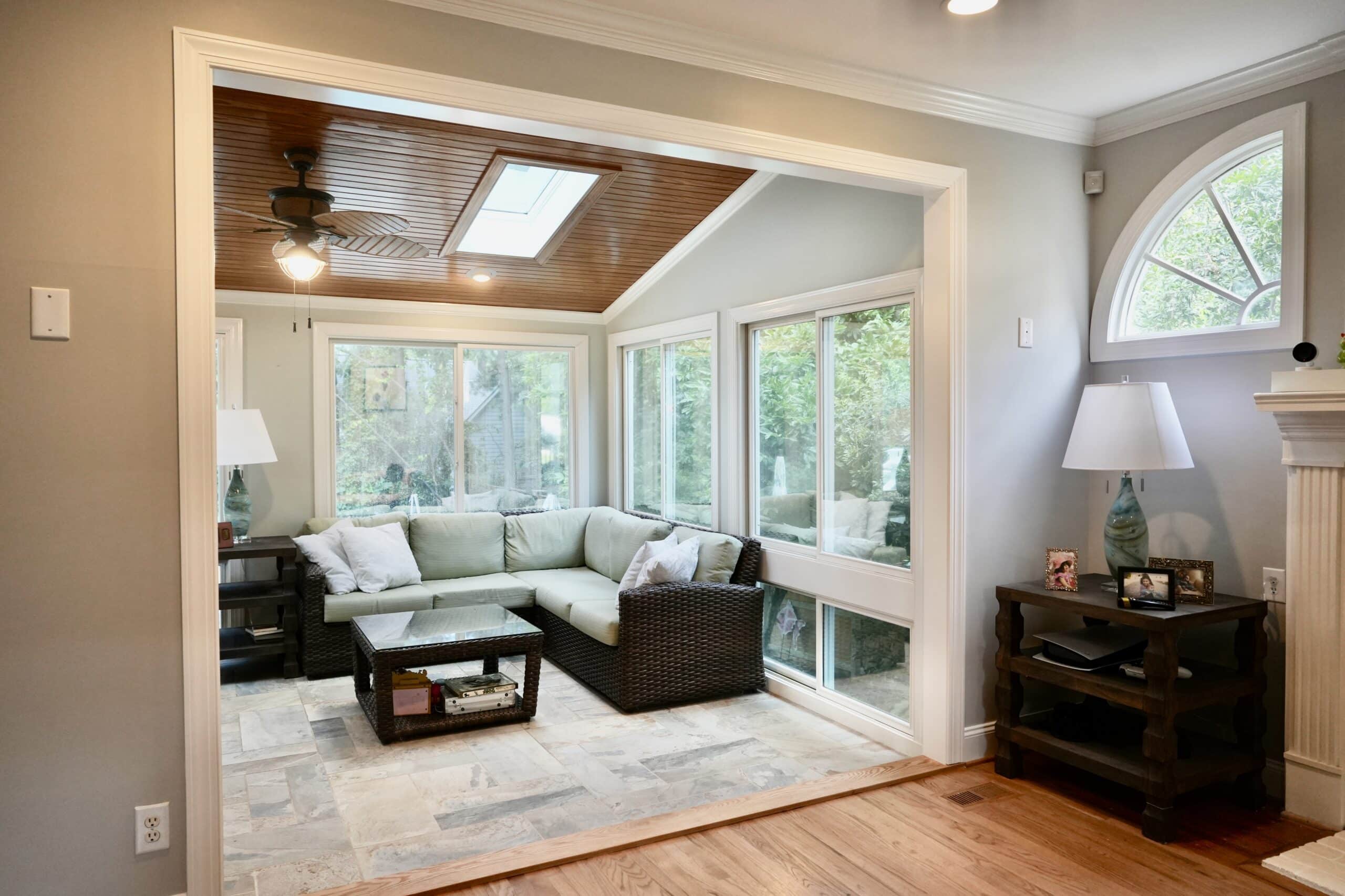 Four-season sunroom with glazed walls, a wood-panelled vaulted ceiling and a skylight